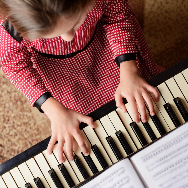 little girl learning play piano home 123211 1131