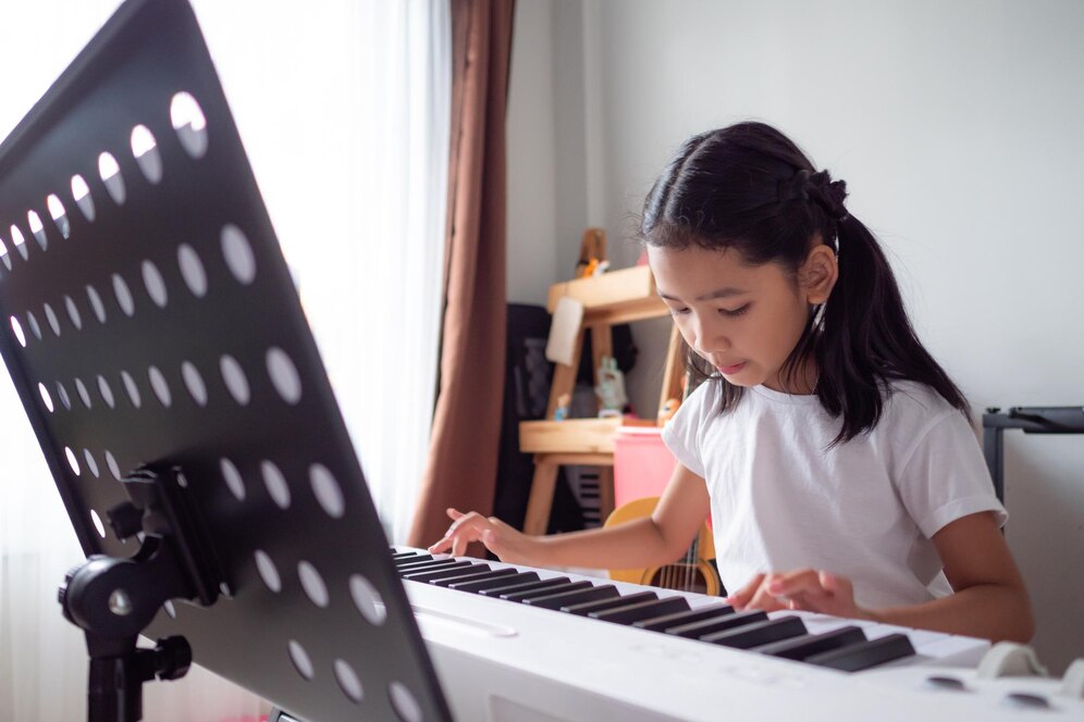 girl-playing-piano-home_1048944-20878329
